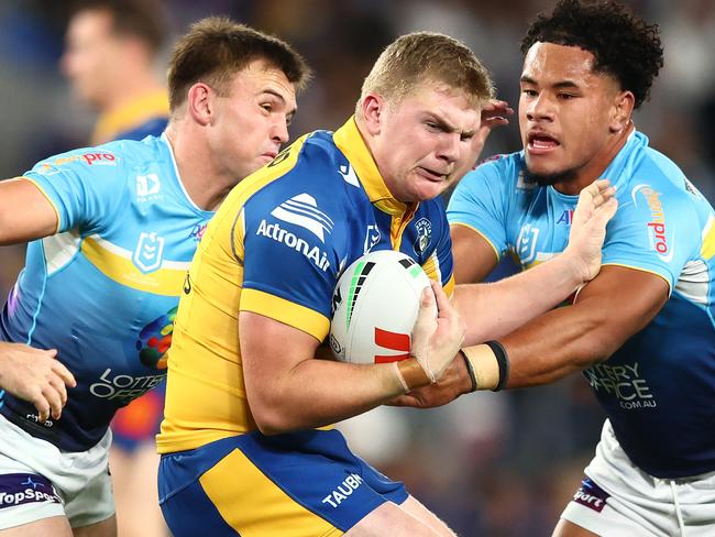 GOLD COAST, AUSTRALIA - JULY 13:  Charlie Guymer of the Eels is tackled during the round 19 NRL match between Gold Coast Titans and Parramatta Eels at Cbus Super Stadium, on July 13, 2024, in Gold Coast, Australia. (Photo by Chris Hyde/Getty Images)