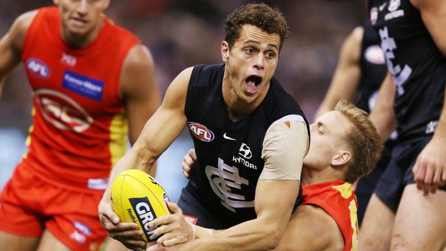 Ed Curnow tries to break a tackle against Gold Coast. Picture: Getty Images