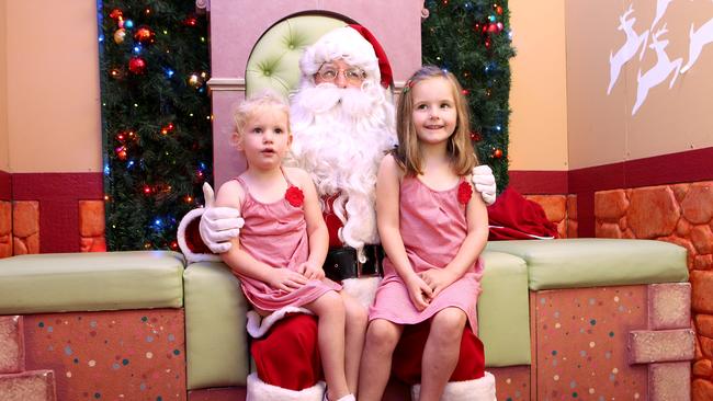 Children having their photos taken with Santa at the Myer Centre in the Queen Street Mall. Pics Tim Marsden