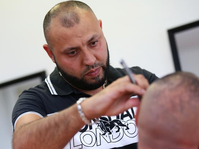 Barber and local business owner Montaz Khabbaz says the junkies are loitering outside his business on Guildford Rd. Picture: Angelo Velardo