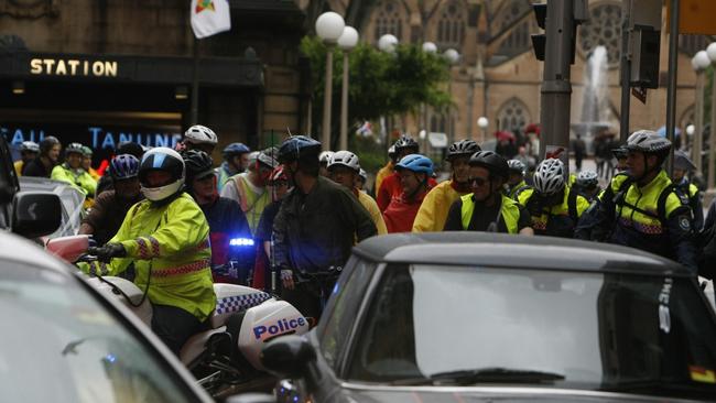 A large group of bike riders led by Critical Mass took over the city's roads as they rode on to Sydney Harbour Bridge at peak hour on a rainy Friday afternoon in 2011.