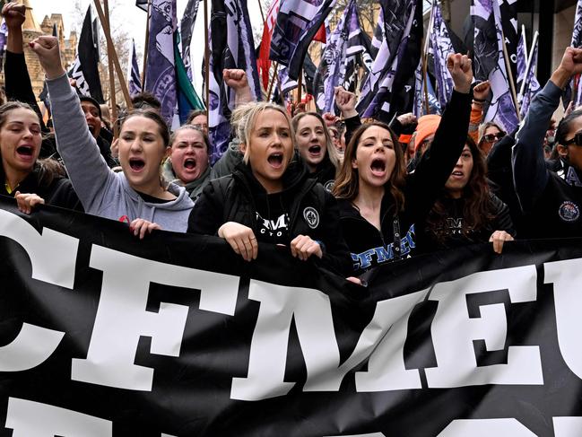 Tens of thousands of workers march after walking off work sites in protest against the forced administration of the construction arm of the Construction, Forestry, Mining and Energy Union (CFMEU), in Melbourne on August 27, 2024. (Photo by William WEST / AFP)