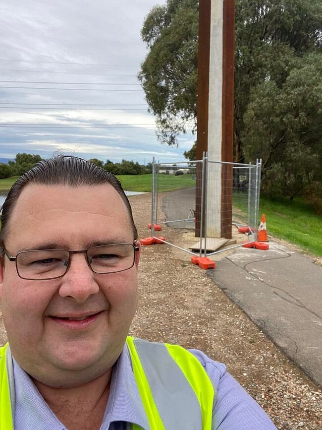 Chad Buchanan with the Stobie pole in the middle of the bikeway.