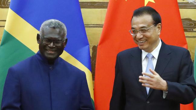 Solomon Islands Prime Minister Manasseh Sogavare and Chinese Premier Li Keqiang attend a signing ceremony in 2019.