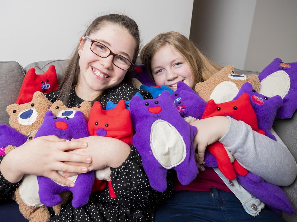 Grace Holiday, 11 and Chloe Moore, 12 have made ISO cuddle bears to give to people with disability and illness who are still in isolating because they are at increased risk of COVID-19.Picture: RICHARD JUPE