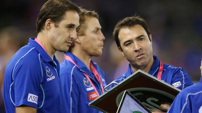 Cameron Joyce with former North Melbourne senior coach Brad Scott. Picture: MICHAEL KLEIN