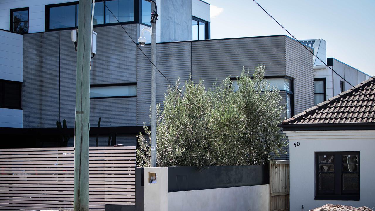 The (repaired) wall between the Sebastian “fortress” (left), and Mr Hanslow’s Maroubra home. Picture: Julian Andrews.