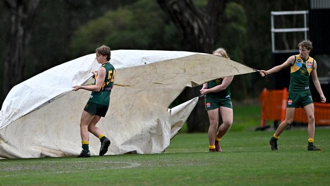 VAFA: The covers come out after the Old Trinity and Old Xaverians match was called off. Picture: Andy Brownbill