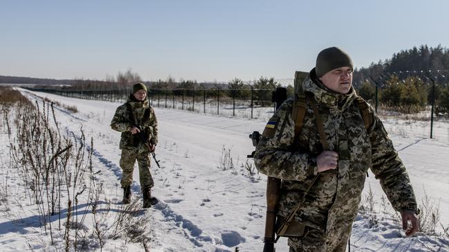 Members of the Ukrainian Border Guard patrol at the Three Sisters border crossing between, Ukraine, Russia and Belarus this week. Picture: Getty Images