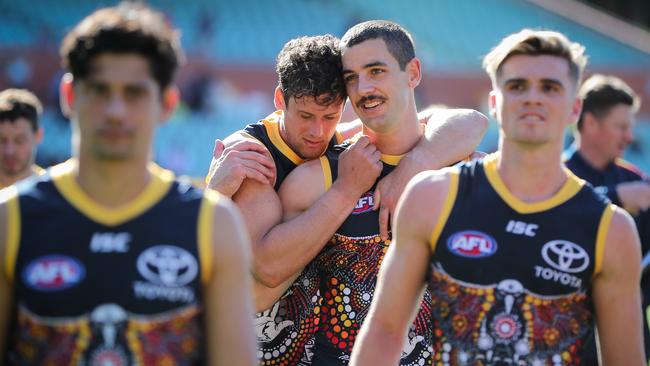 Taylor Walker with Kyle Hartigan after the loss to Geelong. Picture: Matt Turner/Getty