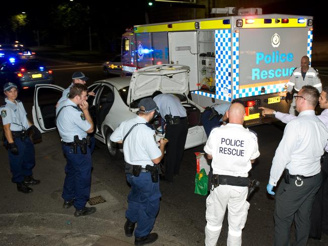 NSW Police arrested three people on Elizabeth St in Surry Hills after it was discoved that the trio were in possession of trafficable quantities of methamphetamine and heroine. Picture: Gordon McComiskie