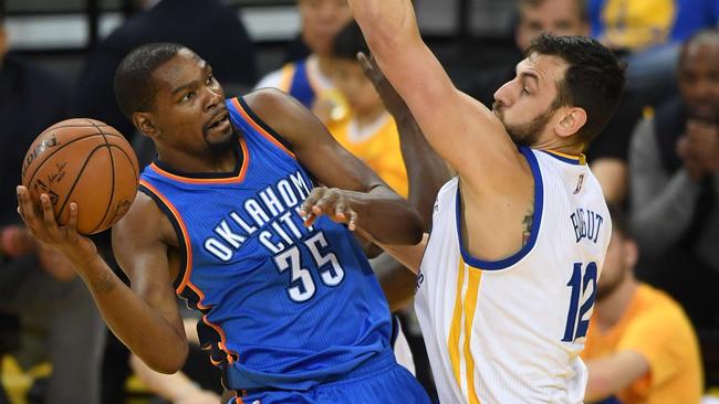 Kevin Durant #35 of the Oklahoma City Thunder takes a shot against Andrew Bogut #12 of the Golden State Warriors during Game Five.