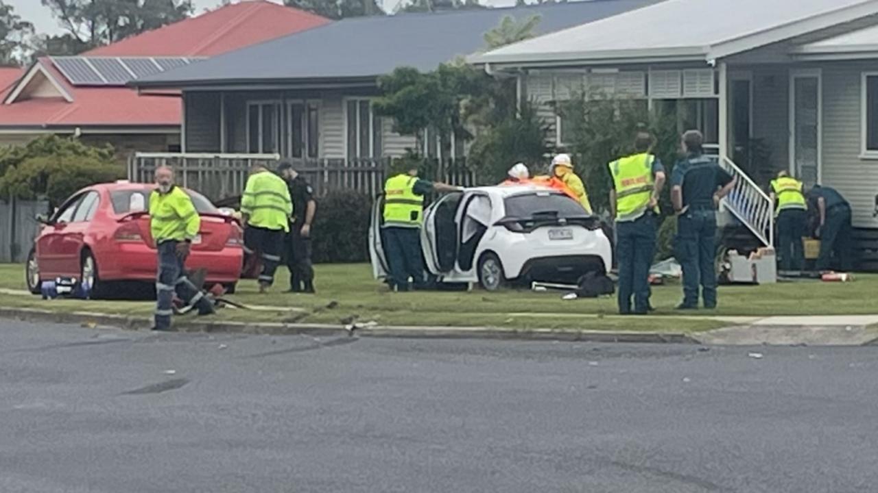 Woman trapped in vehicle after two-car crash