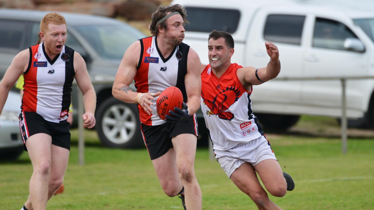 Southern Football League match between Christies Beach and Flagstaff Hill at Christies Beach, Saturday, August 17, 2019. Jarryd McCormack is tackled by Benjamin Rossi from Flagstaff Hill. (Pic: AAP/Brenton Edwards)