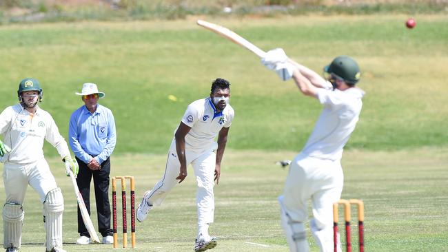 St Bernard's Arosh Janoda digs in a short ball against Box Hill on Saturday. Picture: Josie Hayden