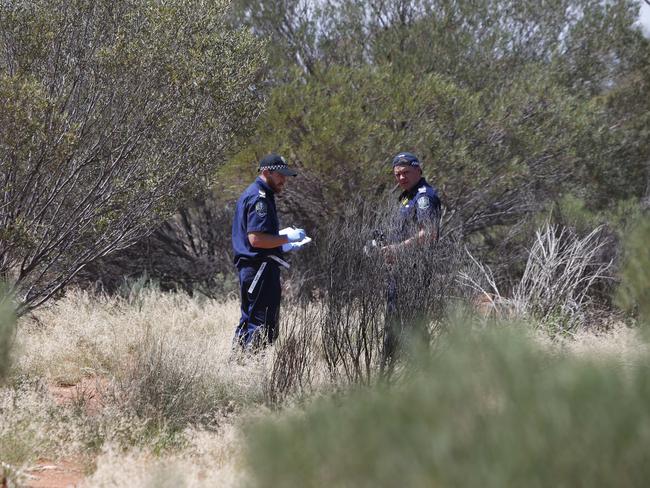 Forensic officers inspect the site near where Mrs Woodforde’s body was found. Picture: Simon Cross