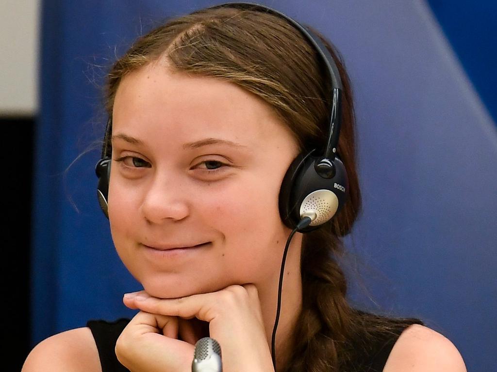 Swedish climate activist Greta Thunberg reacts after her speech during a meeting at the French National Assembly, in Paris, on July 23, 2019. (Photo by Lionel BONAVENTURE / AFP)