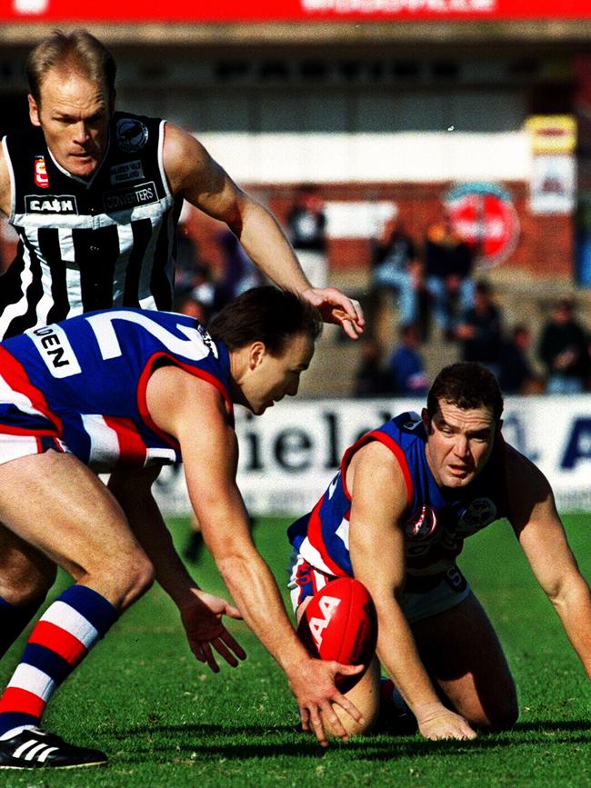 John Abbott, right, against Port Adelaide at Alberton in the 1990s.