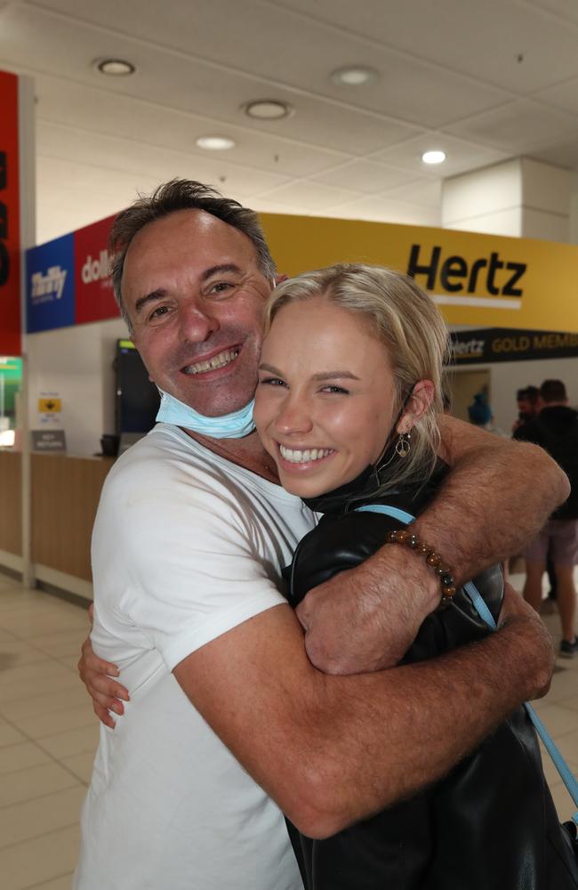 Surfers Paradise couple Anthony and Isla Stanich reunited at Gold Coast Airport on Monday. Picture Glenn Hampson