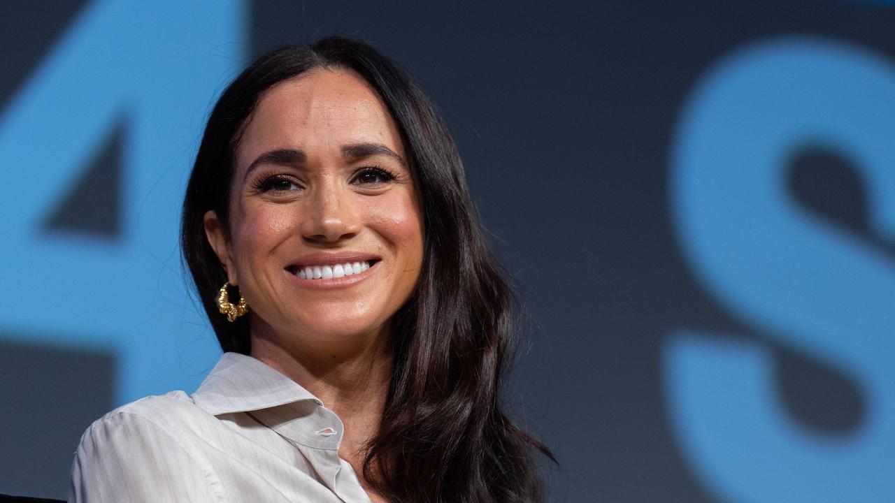 Meghan took the chance to launch a new brand as William took to the stage. Photo by SUZANNE CORDEIRO / AFP.