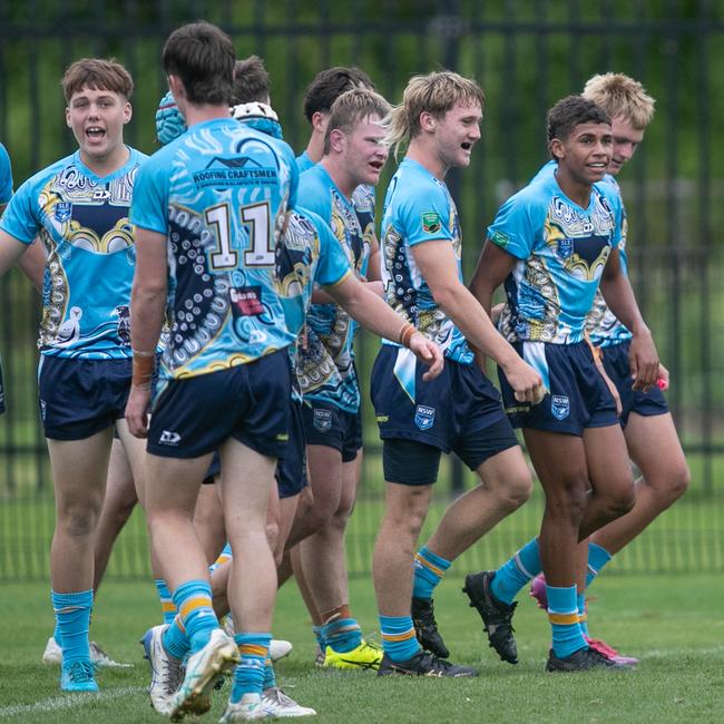 Jaylon Russell (right, black boots) and Northern Rivers Titans teammates in the Andrew Johns Cup semi final match against the Illawarra South Coast Dragons earlier this year.