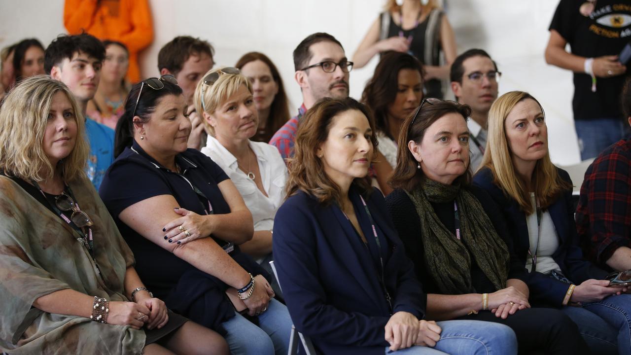 Jennie Ross-King (second row, third from left) and Coroner Harriet Grahame (front row, second from left) at the pill-testing demonstration. Picture: Regi Varghese/AAP