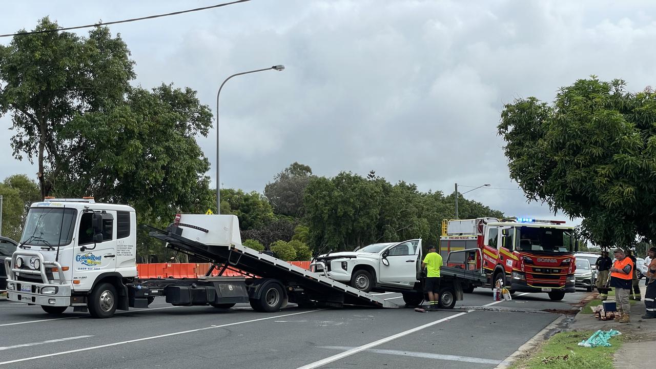 QPS and QFES were called to Paradise road after a vehicle reported rolled over onto its side. Photo: Fergus Gregg