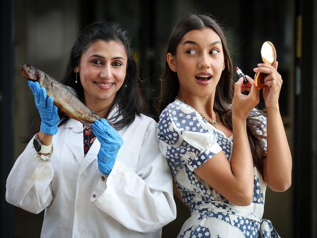 Swinburne University academic director and team leader for Smart Materials Nisa Salim with the fish product and Jasmine Ng using the finished product. Picture: David Caird