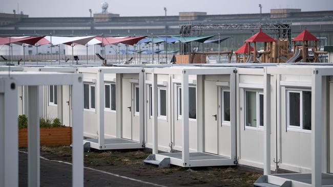 Container homes for refugees are pictured some days before the inauguration of the accomodation at the Tempelhofer Feld former airfield in Berlin, on December 1, 2017. The village of 256 apartments made of three containers each offers space for more than 1,000 refugees. The first residents of the so-called "Tempohomes" will move in by the beginning of December. / AFP PHOTO / dpa / Bernd von Jutrczenka / Germany OUT