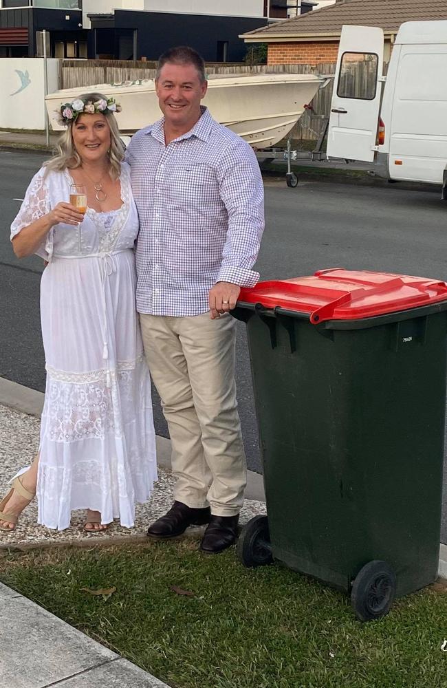 Lee Withers and Chris Boehm, of Albany Creek, on their wedding day on April 12. After the ceremony they took their bin out to the footpath to post on the Bin Isolation Outing Facebook page.