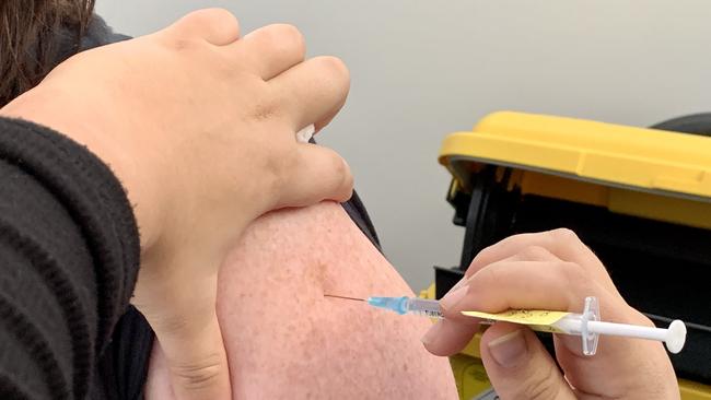 Patient receives the Pfizer Covid-19 vaccine.