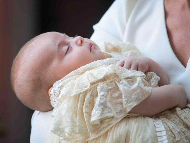 Prince Louis wears a handmade replica of the Royal Christening Robe. Picture: AFP