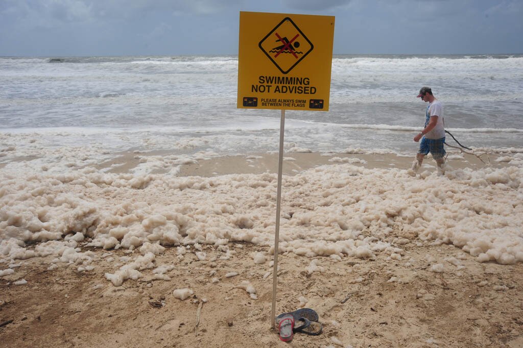 Foam covers Maroochydore Beach after heavy rain and large seas. Picture: Brett Wortman