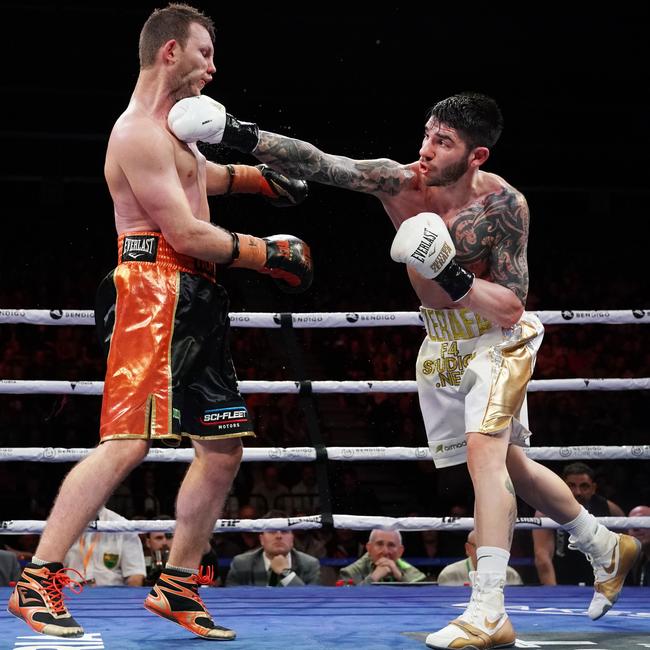 Michael Zerafa rocks Jeff Horn at the Bendigo Stadium. (AAP Image/Michael Dodge)