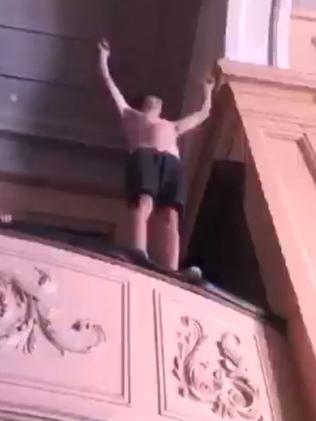 Dancing on the balcony before he jumped. Picture: Brendon Maczkowiack