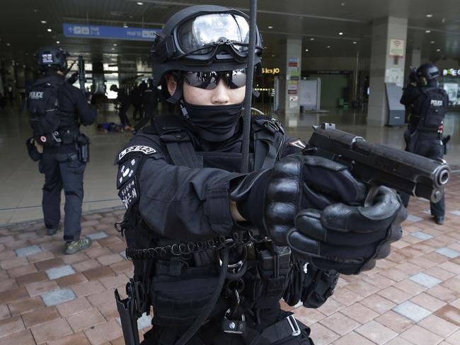 A South Korean police officer aims his gun during an anti-terror drill as part of Ulchi Freedom Guardian exercise, in Goyang, South Korea. Picture; AP Photo/Ahn Young-joon.