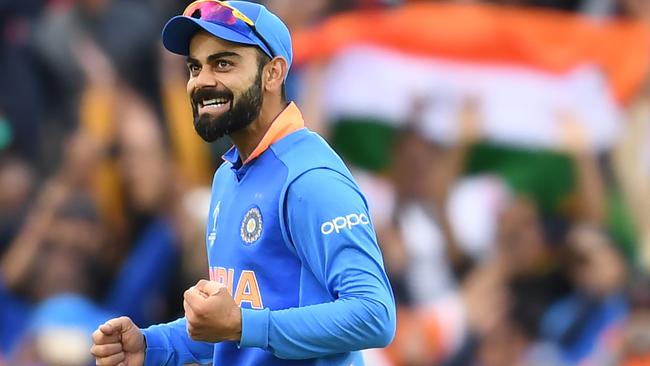 India's captain Virat Kohli celebrates after victory in the 2019 Cricket World Cup group stage match between India and Australia at The Oval in London on June 9, 2019. (Photo by Dibyangshu SARKAR / AFP) / RESTRICTED TO EDITORIAL USE