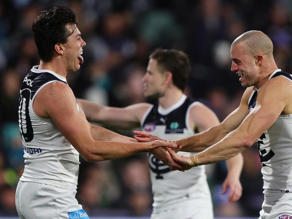ADELAIDE, AUSTRALIA - MAY 30: Alex Cincotta of the Blues celebrates a goal with Elijah Hollands during the 2024 AFL Round 12 match between the Port Adelaide Power and the Carlton Blues at Adelaide Oval on May 30, 2024 in Adelaide, Australia. (Photo by Sarah Reed/AFL Photos via Getty Images)