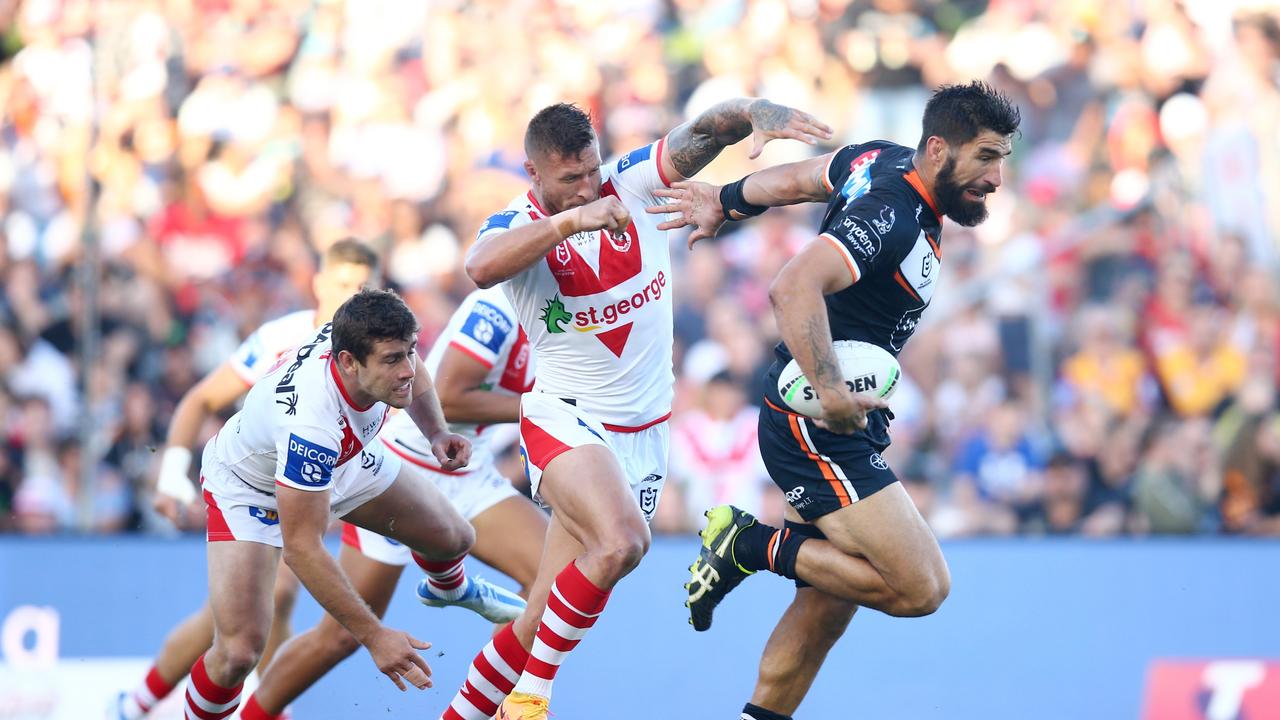 WOLLONGONG, AUSTRALIA - MAY 01: James Tamou of the Tigers makes a break during the round eight NRL match between the St George Illawarra Dragons and the Wests Tigers at WIN Stadium on May 01, 2022 in Wollongong, Australia. (Photo by Jason McCawley/Getty Images)
