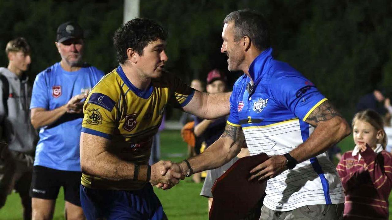 Yeppoon Seagulls' A-grade captain Sam Holzheimer receives the Rhys Yore Memorial Shield from Shane Yore. Photo: Leeann Booth