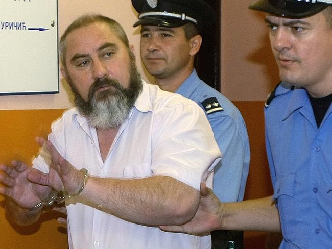 Prison guards escort Damir Dokic to the courtroom for his retrial for threatening Australia’s ambassador to Serbia Picture: AP