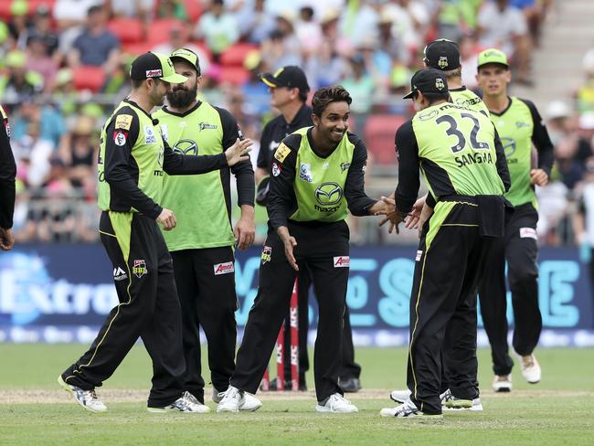 Arjun Nair (centre) of the Thunder celebrates taking the wicket of Ben Laughlin of the Strikers with teammates during the Big Bash League (BBL) match between the Sydney Thunder and the Adelaide Strikers at Spotless Stadium in Sydney, Sunday, January 13, 2019. (AAP Image/David Neilson) NO ARCHIVING, EDITORIAL USE ONLY, IMAGES TO BE USED FOR NEWS REPORTING PURPOSES ONLY, NO COMMERCIAL USE WHATSOEVER, NO USE IN BOOKS WITHOUT PRIOR WRITTEN CONSENT FROM AAP