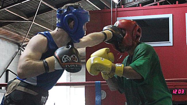 Jeff Horn lands a shot on Anthony Mundine during their sparring session in 2013. Picture: Annette Dew