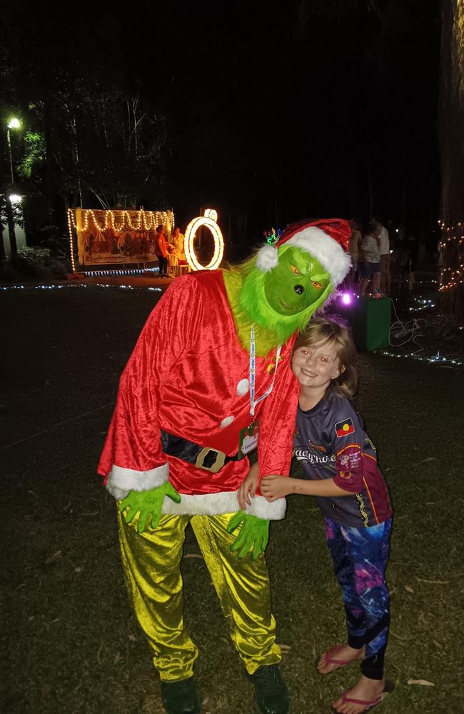 Paige with Santa: Botanical Gardens light 2023 - Fraser Coast. Sent in by her mum, Tezza Ebert.