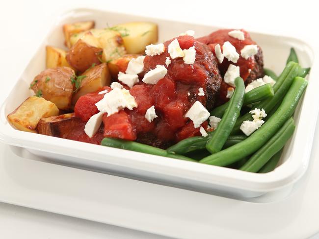 Qantas airlines unveils new food options on all international economy routes, replacing the old tray service. A supplied photo of the spiced lamb koftas with tomato, Riverina feta and roast potatoes.