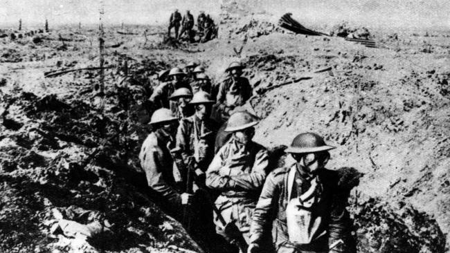 Australian soldiers wearing gas masks in trench on Western Front at Garter Point near Ypres.