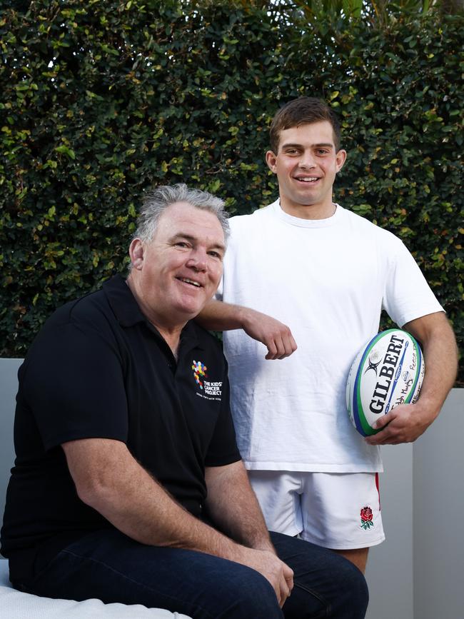 Hugo Kulcsar, pictured with Wallabies legend Owen Finegan, is now cancer free.