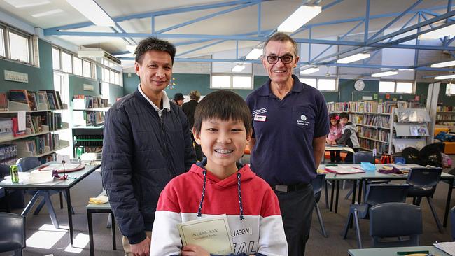 Jason Tang with his father Song Tuon (left) and mentor Tony Hunt (right) on the day of the scrabble tournament. (IMAGE / Carmela Roche).