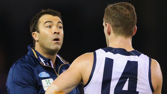 MELBOURNE, AUSTRALIA - JUNE 18: Cats head coach Chris Scott speaks to Joel Selwood during the round 13 AFL match between the Western Bulldogs and the Geelong Cats at Etihad Stadium on June 18, 2016 in Melbourne, Australia. (Photo by Michael Dodge/Getty Images)