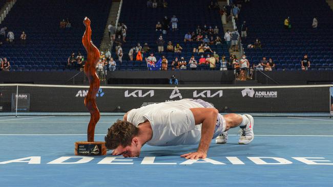 Thanasi Kokkinakis kisses the Adelaide logo after winning against Arthur Rinderknech of France in the men's singles final match at Adelaide International ATP 250 tennis tournament in Adelaide last January 15. Picture: Brenton Edwards/AFP